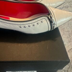 The Marc Jacobs Ivory Pointed Toe Flats with zipper accents.